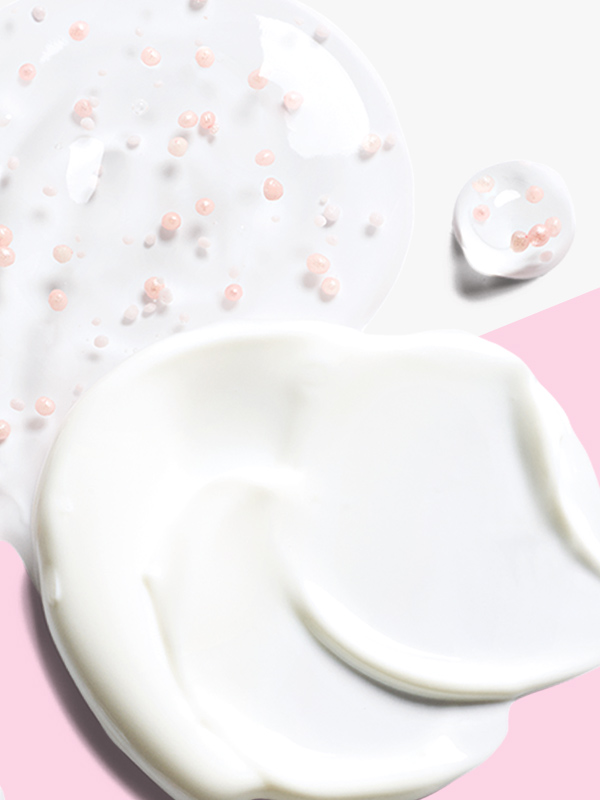 A dab of the day cream from the Mary Kay &ldquo;Miracle Set&rdquo; (TimeWise Daytime Defender SPF 30) and a dab of the night serum (TimeWise Nighttime Recovery) on a pink-and-white background.